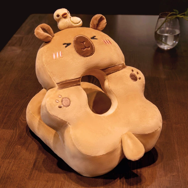 Brown capybara nap pillow (little duck on top)