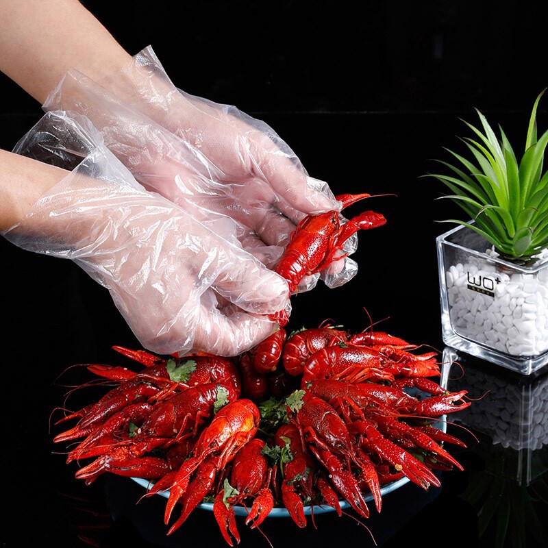 Food kitchen household protective disposable gloves thickened transparent plastic PE hairdressing and catering 100 pieces wholesale