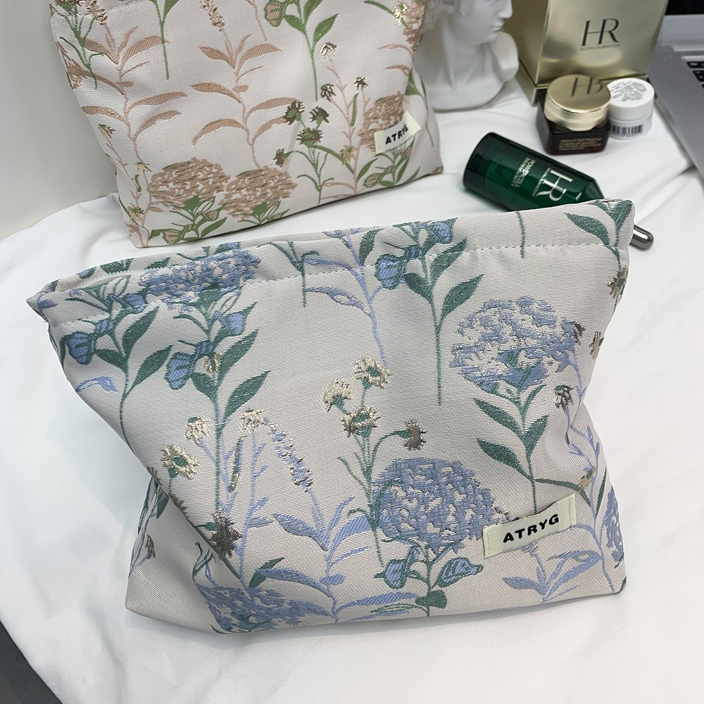 Bolsa de maquillaje, una pequeña bolsa fresca portátil de gran capacidad, bolsa de almacenamiento para productos de cuidado de la piel, bolsa de mano.