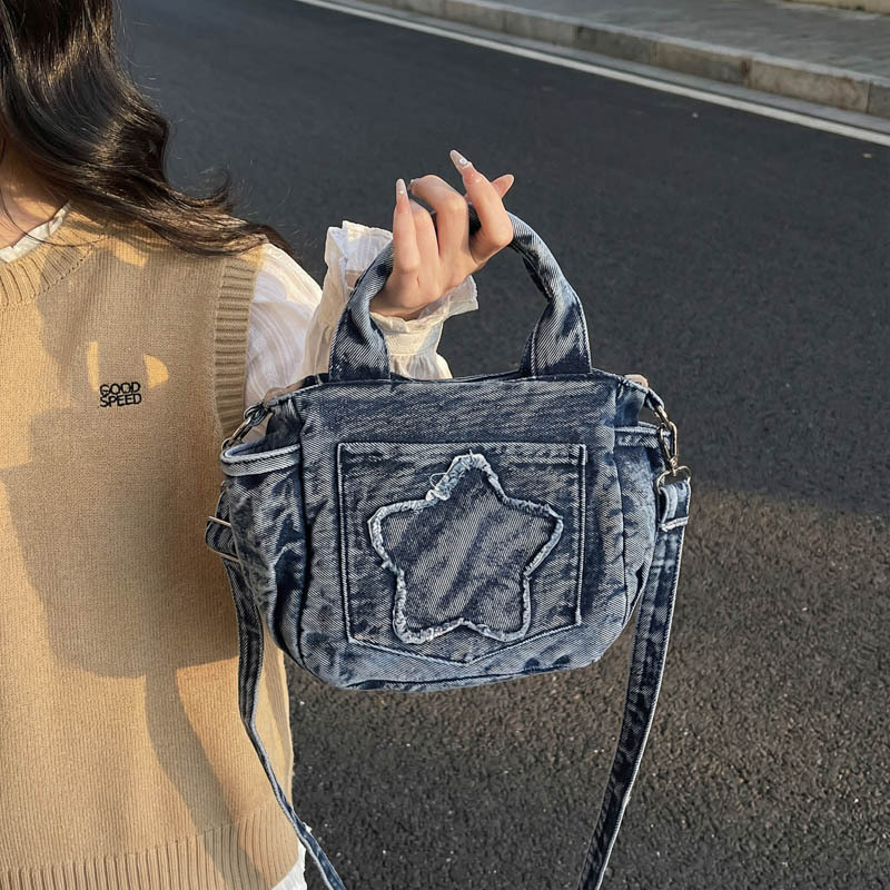 Europa y los Estados Unidos retro vaqueros bolsas de hombro para hombres y mujeres bolsas de estrellas portátiles ligeras y casuales 2026 nueva versión coreana bolsas para niños