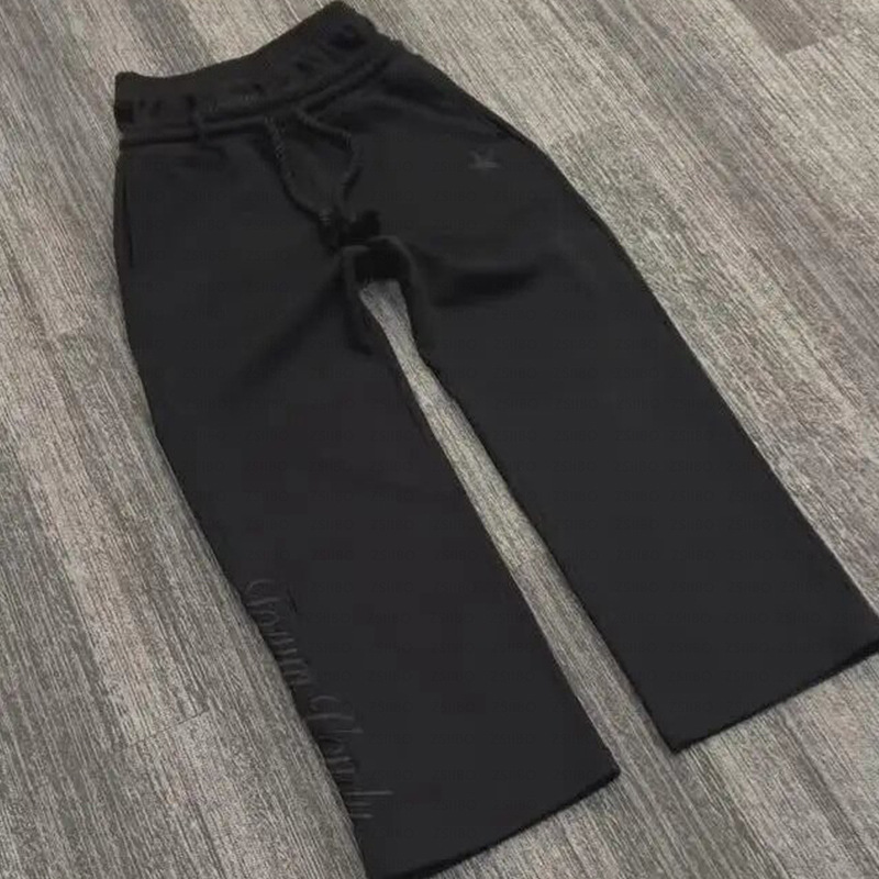 Spot europeo y americano pesado otoño e invierno 2025 principios de primavera doble cintura falso dos pantalones sueltos con cordón pantalones bordados al por mayor