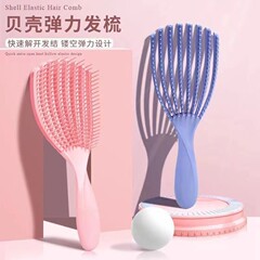 卸売りの骨の大きい曲がった櫛の貝殻は高くて、弾がふわふわしています。