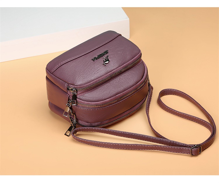 Women's Medium Pu Leather Solid Color Fashion Oval Zipper Crossbody Bag display picture 1