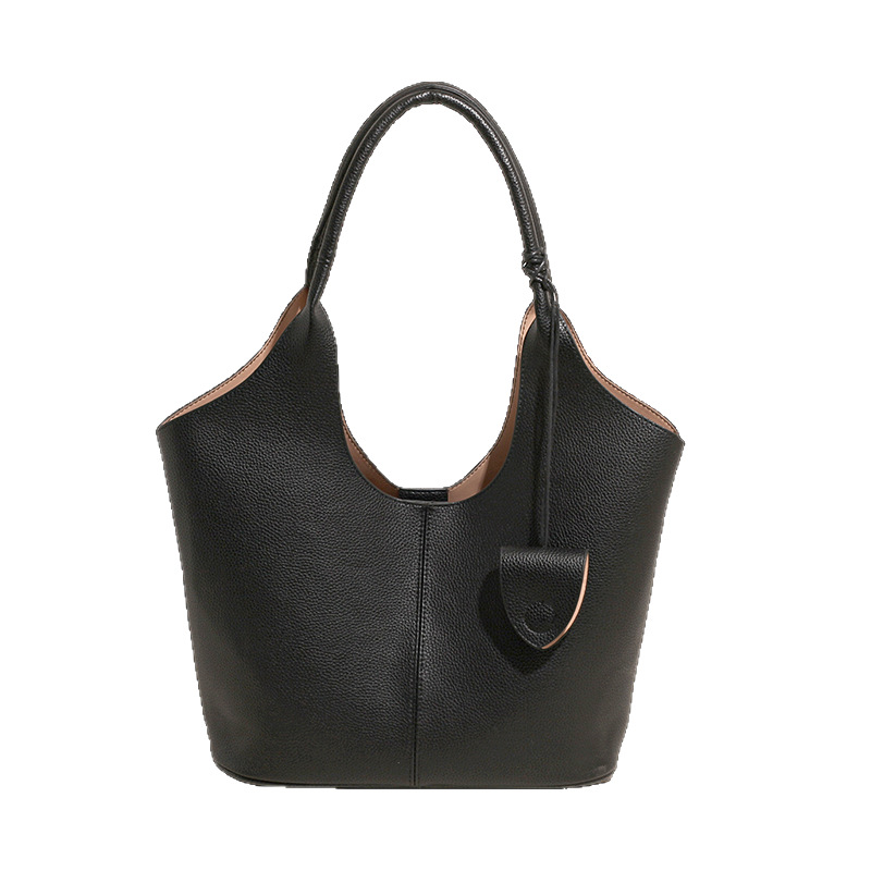 Versión coreana del bolso de alta capacidad 2025 nuevo bolso de cubo de todo fósforo de moda bolso de hombro simple bolso de axila de color sólido