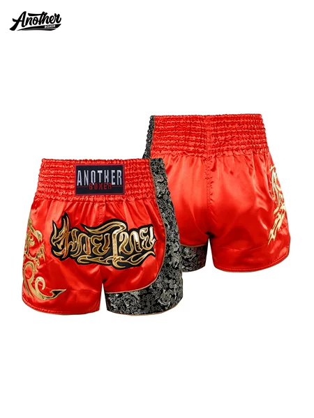 ANOTHERBOXER red and gold Muay Thai shorts, available in adult and children's sizes, designed for championship matches