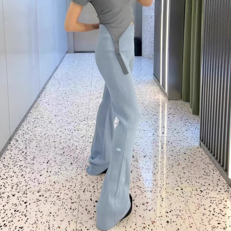 High-Waisted Aio Solid Color Knit Flared Pants with Small Logo on the Leg, Wide-Leg Pants, Slightly Flared Floor-Length Pants, Slimming Long Pants for Women High-Waisted Aio Solid Color Knit Flared Pants with Small Logo on the Leg, Wide-Leg Pants, Slightly Flared Floor-Length Pants, Slimming Long Pants for Women