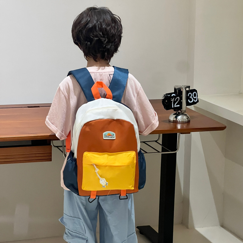 2025 mochila de moda coreana para niños y niñas, mochila para niños de jardín de infantes, nueva mochila para niños de color exterior