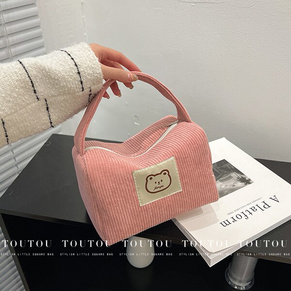 Handheld cosmetic bag