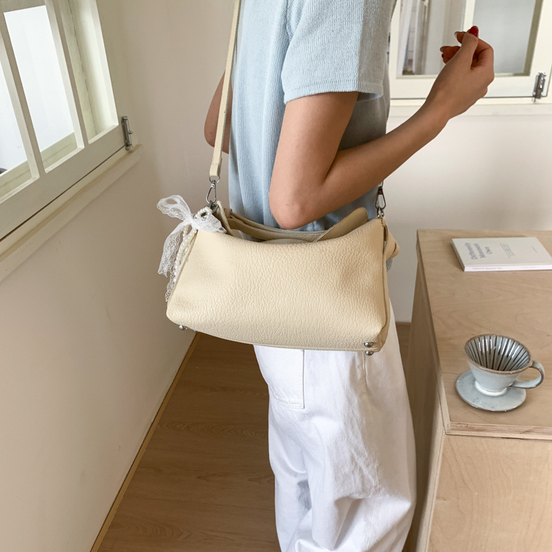 Bolsa de hombro portátil de gran capacidad para mujeres 2026 sensación cotidiana de lichi estampado bolso de almohada coreano bolso de brazo
