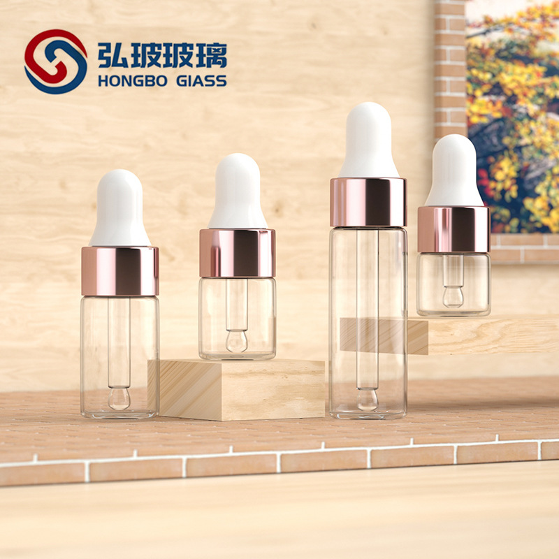 Fabricante en stock 1 ml2ml3ml5ml oro rosa cuentagotas botella de vidrio líquido sub-botella flor de cerezo en polvo