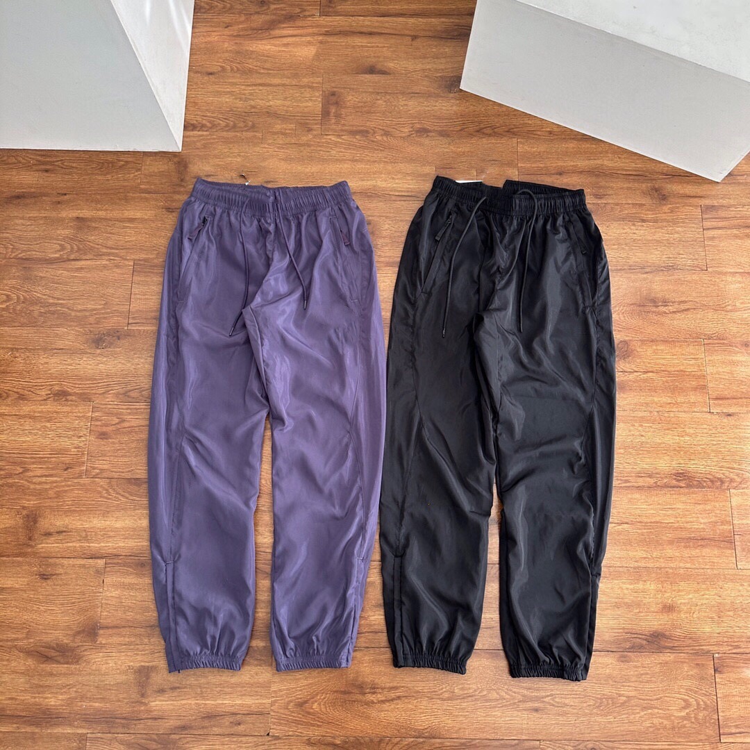 Pantalones deportivos tejidos primavera-verano pareja nuevo nylon rápido secado abrazamiento de pies tejido pantalones deportivos de doble capa para hombre