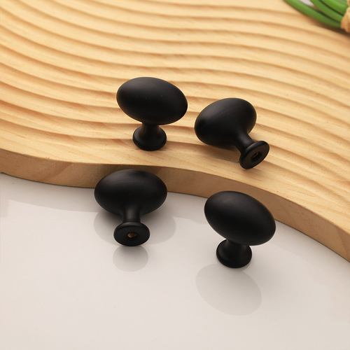 Gold French-style bedside cabinet with elliptical drawer pulls, electroplated plastic single hole handles, pigeon egg design