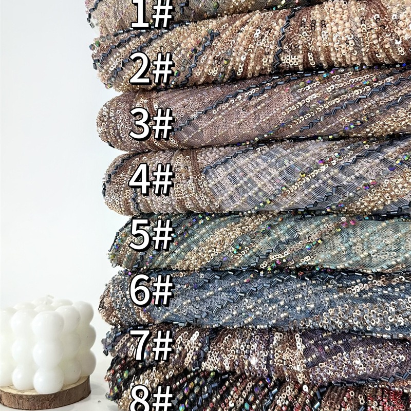 Tejido de malla de bordado de industria pesada bordado de tubo de perlas tridimensional vestido de boda cena tela de moda spot transfronterizo