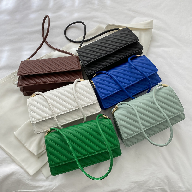 Bolsas de mujer de color sólido retro 2022, bolsas de hombro de estilo moderno, bolsas de ocio simples.