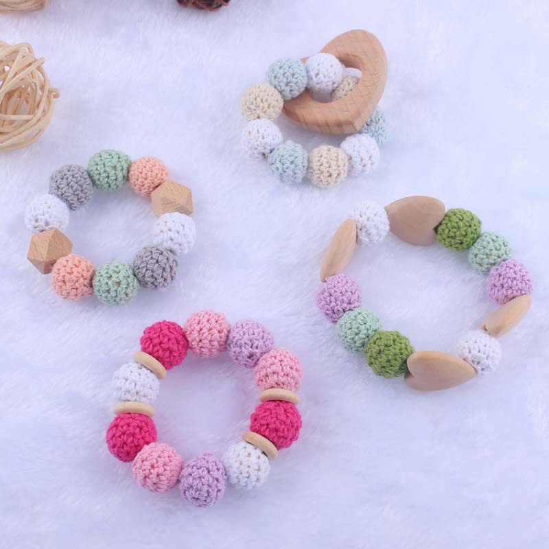 Nueva historieta del bebé haya amor mordedor juguete DIY macaron gran bola de lana mordedura pulsera