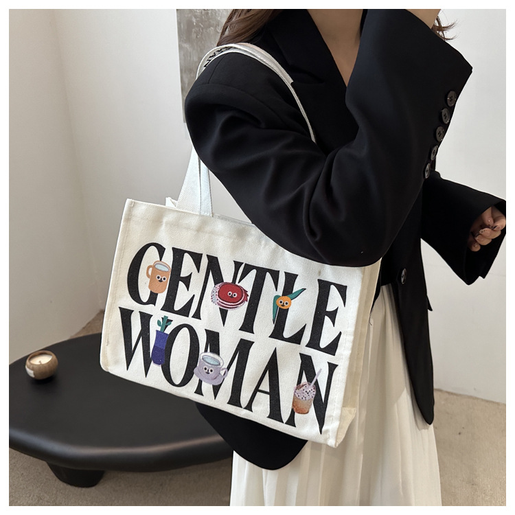 Large-capacity letter canvas bag 2025 new style ins printed versatile shoulder bag for commuting and portable ladies' tote bag undefined