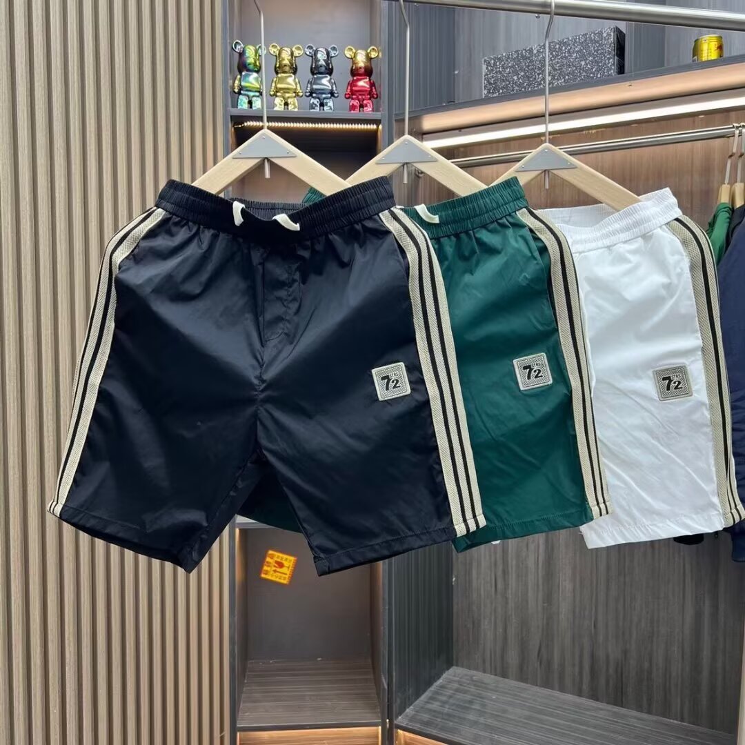 Pantalones cortos de cinco puntos para hombres de verano delgados de moda de alta calidad simple versátil suelta pantalones de playa