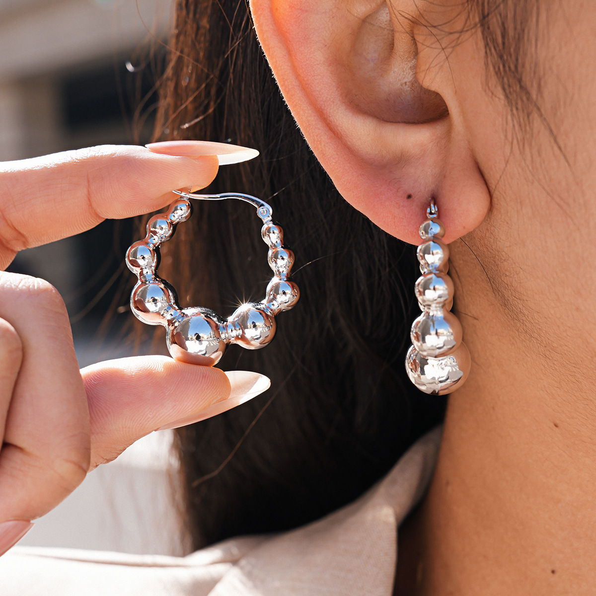 Europa y los Estados Unidos metal sensible a la superficie de brillo perfiles redondos personalidad temperamento diseño pendientes nicho de alta calidad pendientes transfronterizos para mujeres