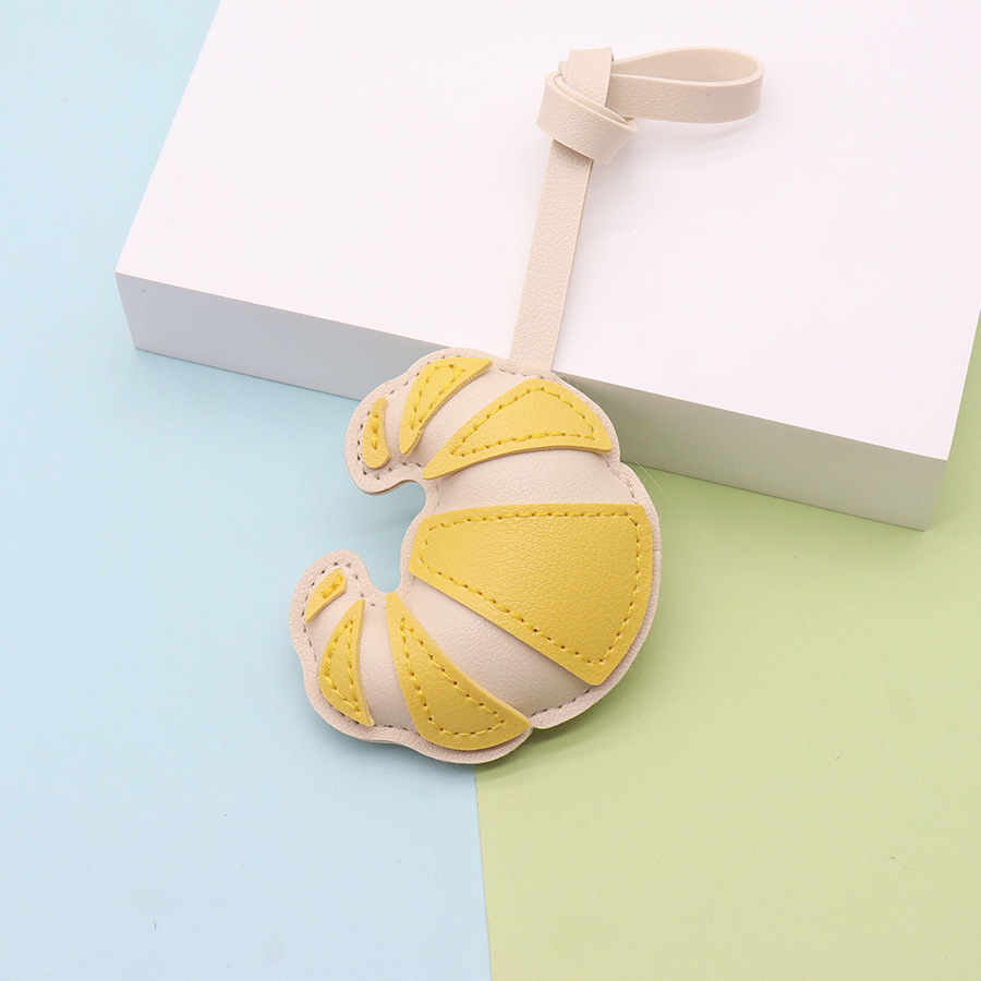 Moda y creatividad cuero de imitación hecho a mano bolso de cuerno hebilla colgante colgante bolso hecho a mano colgante fábrica al por mayor