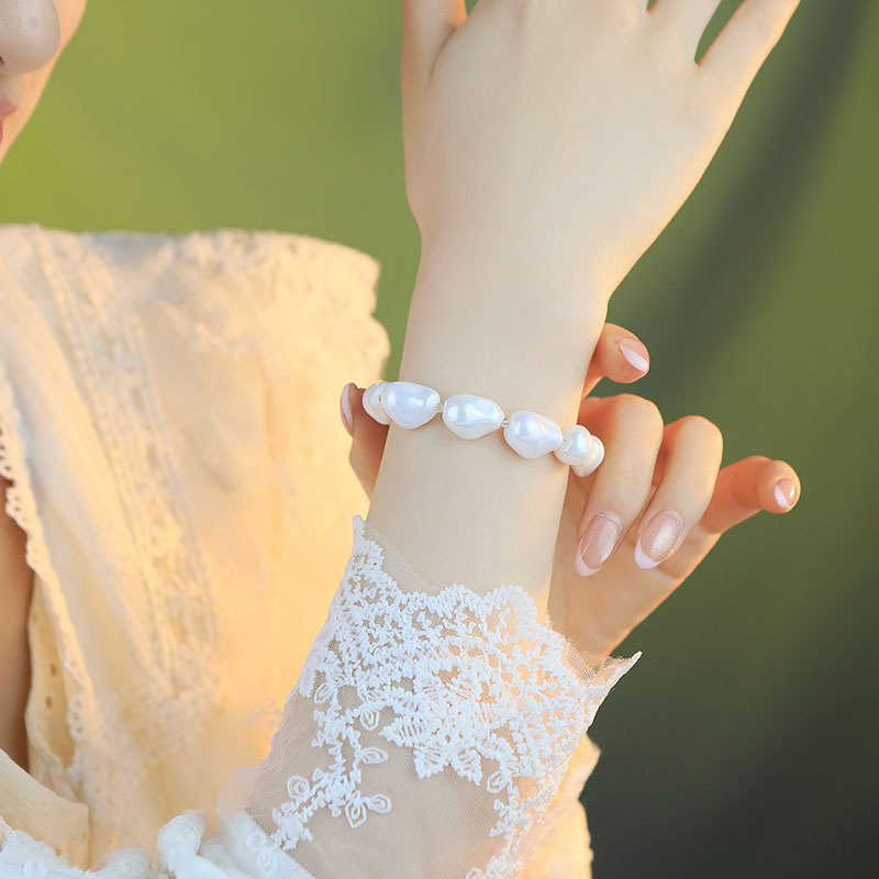 Nuevos productos de alto nivel imitación barroco pulsera de perlas nicho diseño ligero lujoso flujo de cuentas pulsera de pulsera de absorción magnética exquisita