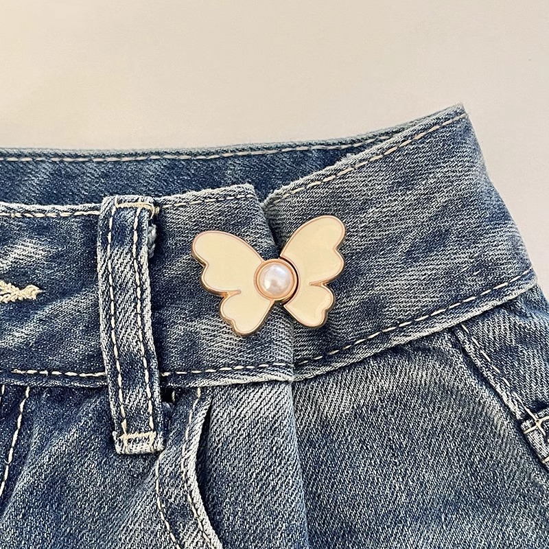 Botón de cintura de mariposa alta sensación jeans ajuste de cintura de botón fijo pantalones más grandes para reducir el pasador de hebilla sin costura