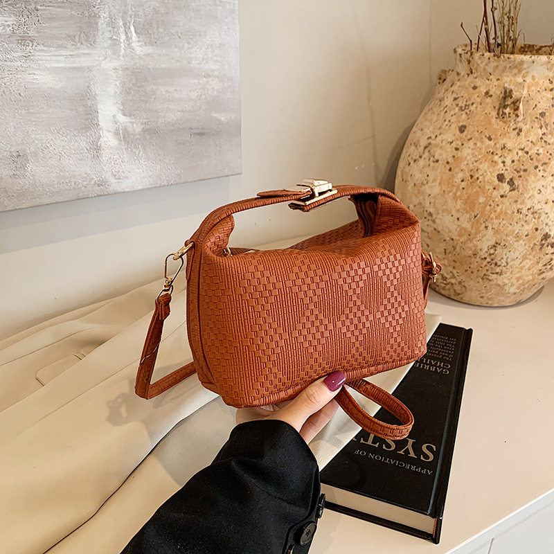 Bolsa de mano a rayas de moda coreana para mujeres otoño / invierno 2024 nuevo estilo simple bolso de hombro personalizado gran capacidad mochila