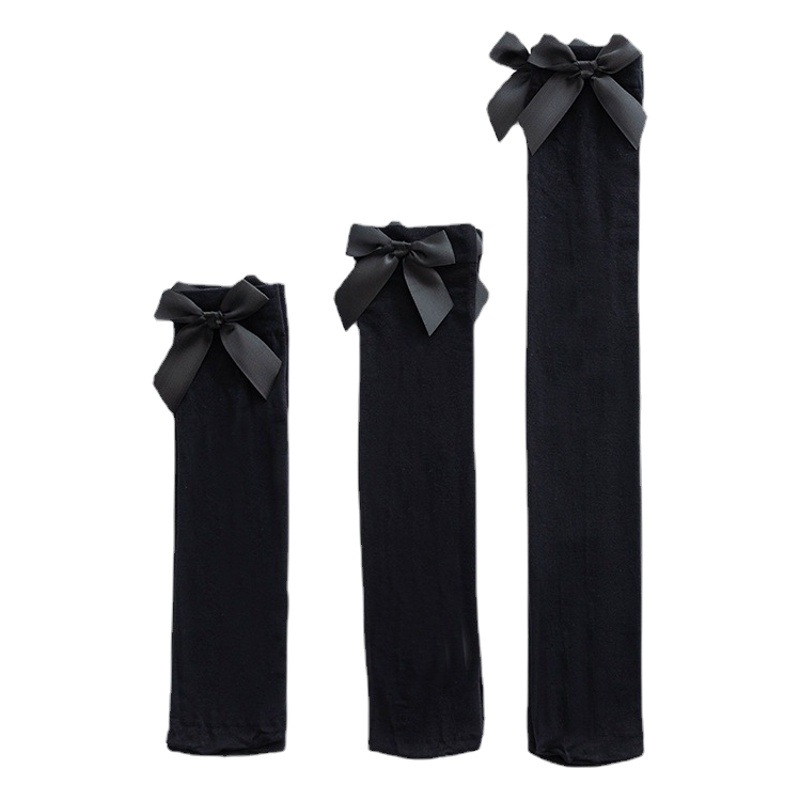 Calcetines de mujer de terciopelo fino arco estilo JK estilo preppy calcetines de color sólido a media pierna sobre la rodilla calcetines al por mayor