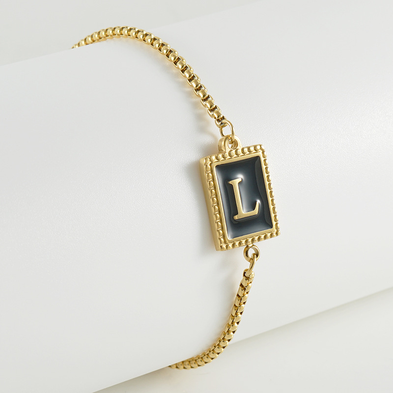 La moda europea y americana transfronteriza del acero inoxidable 26 pulsera inglesa de la letra en relieve pulsera Titanium de la cremallera del acero 18K de la frontera para las mujeres