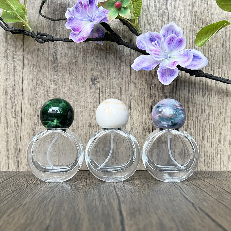 现货供B043-25ml 扁圆水晶透明玻璃瓶香水瓶圆形香水喷雾按压空瓶