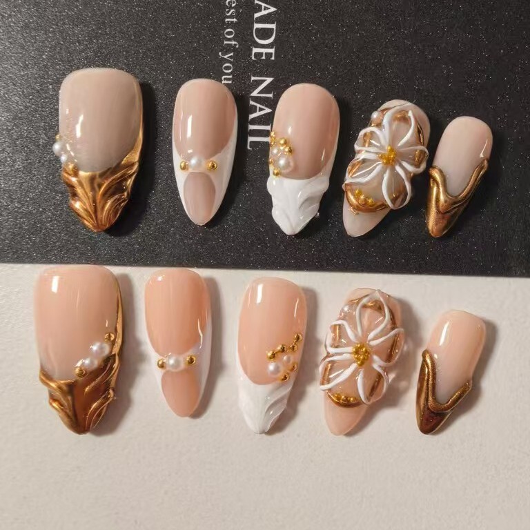 TW specializes in cross-border supply of European and American style light luxury 3D carved press-on nails in nude color with French pearl and metallic nail art patches TW specializes in cross-border supply of European and American style light luxury 3D carved press-on nails in nude color with French pearl and metallic nail art patches