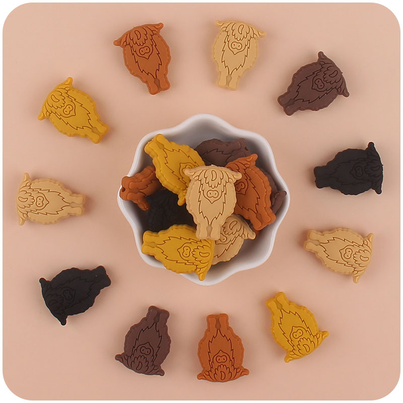 Nuevo bebé suministros de dibujos animados vaca pequeño mordedor creativo DIY bebé molar Cadena de pezón cadena anti-gota accesorios pequeños