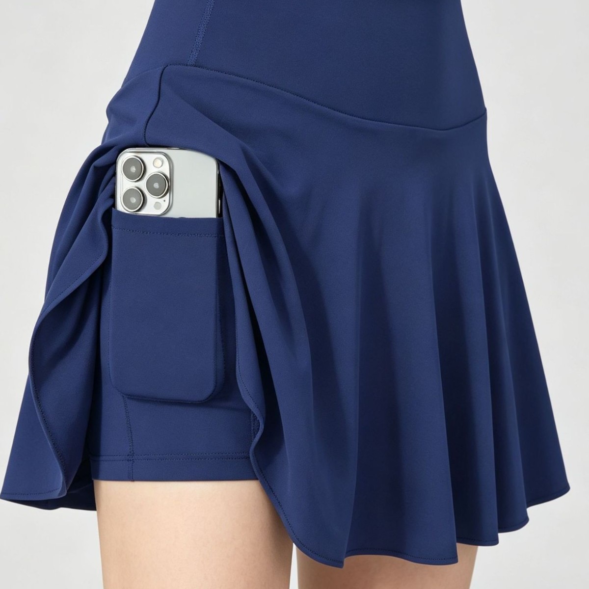Direct manufacturer of women's tennis skirts, high-waisted, anti-exposure, faux two-piece yoga skirt with side phone pocket, supports OEM