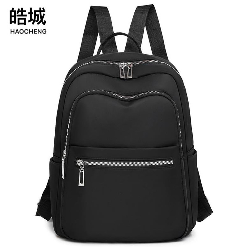 Mochila para mujer 2024 nuevo estilo de color sólido casual para mujer mochila de viaje simple de gran capacidad al por mayor