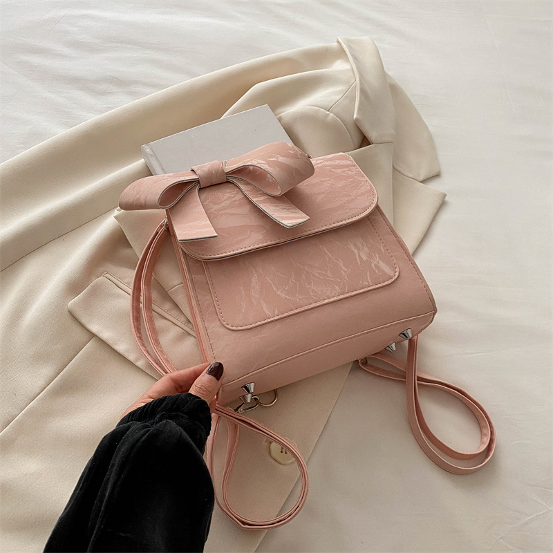 Mochila de hombro de arco para mujeres 2024 nueva moda estilo académico mochila de estilo universal bolso de mano bolso de viaje