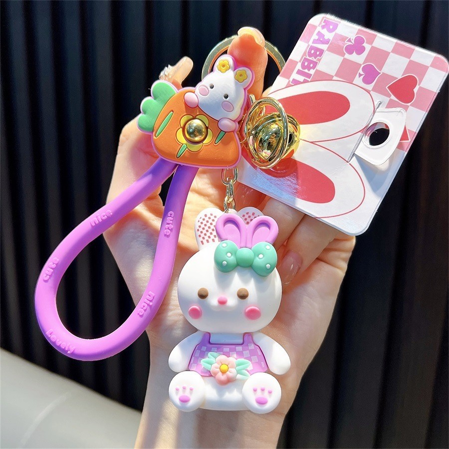 Keychain dinosaurio auténtico lindo bolso colgante de goma blanda llavero de automóvil muñeca pequeña máquina de regalos al por mayor image 13