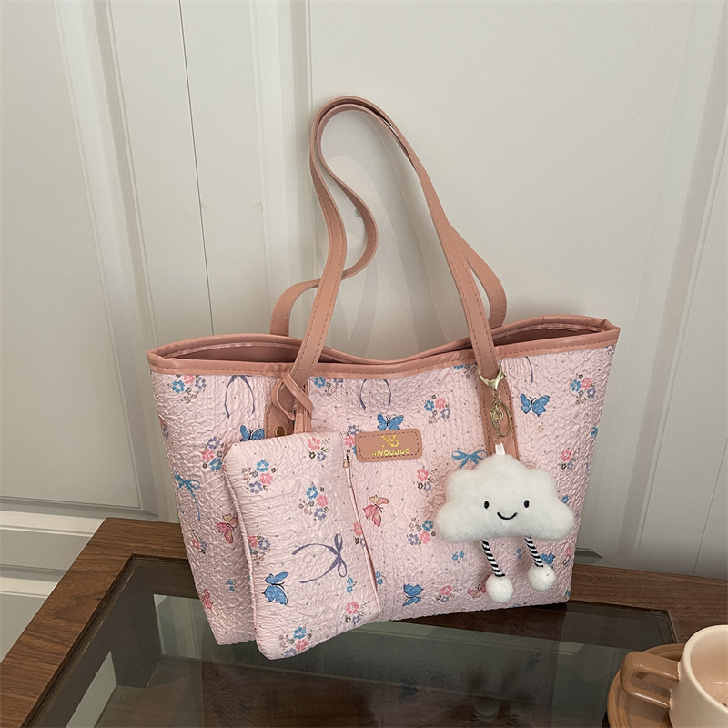 2026 flores coreanas mariposas de gran capacidad de viaje de primavera nueva moda moda extranjera bolso de hombro