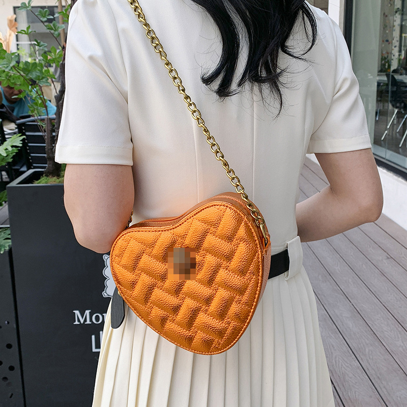 Bolso de hombro transfronterizo para mujer nueva tendencia bolso de corazón de alta gama patrón de lichi ringge bolso de mensajero de cadena de color sólido simple