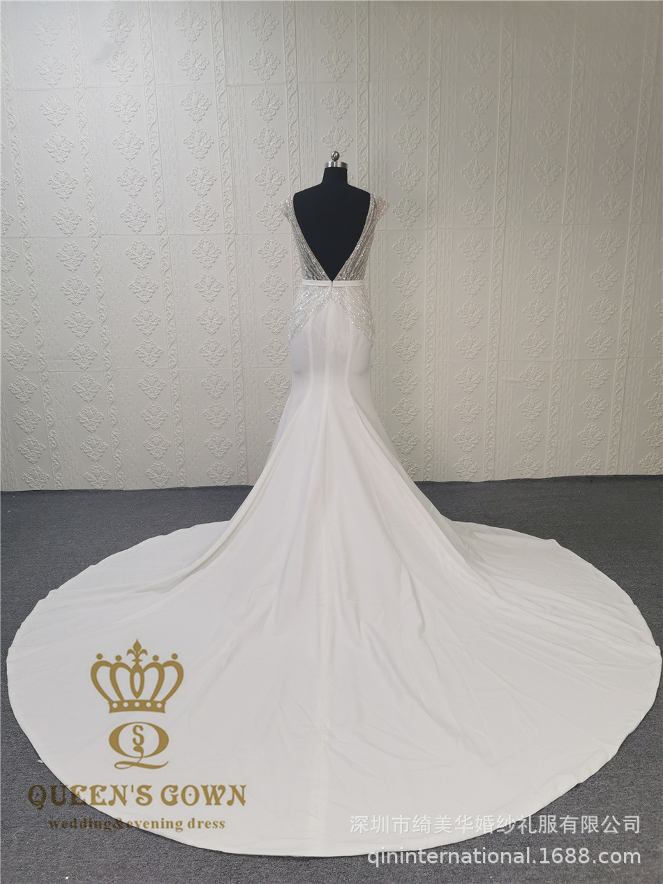 Long elegant beige wedding dress sleevless