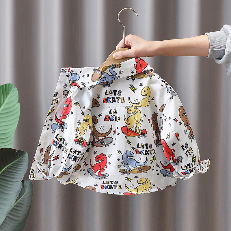 7751 Camisa de primavera para niños Camisa de manga larga con estampado de dinosaurio de dibujos animados para niños Primavera y otoño Tops atractivos de moda Primavera