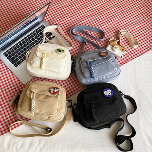 2024 new canvas bag women's Japanese style fresh solid color bag student casual shoulder bag mobile phone bag small shoulder bag