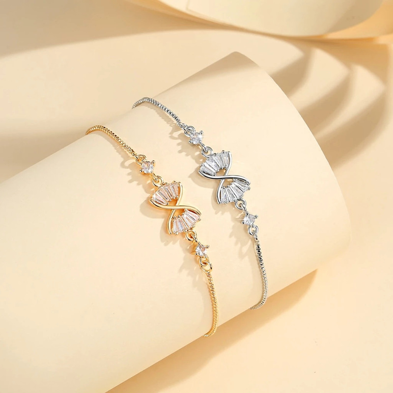 Cross-border explosions fashion bow bracelet female niche Joker copper gold inlaid zircon push zipper hand jewelry wholesale