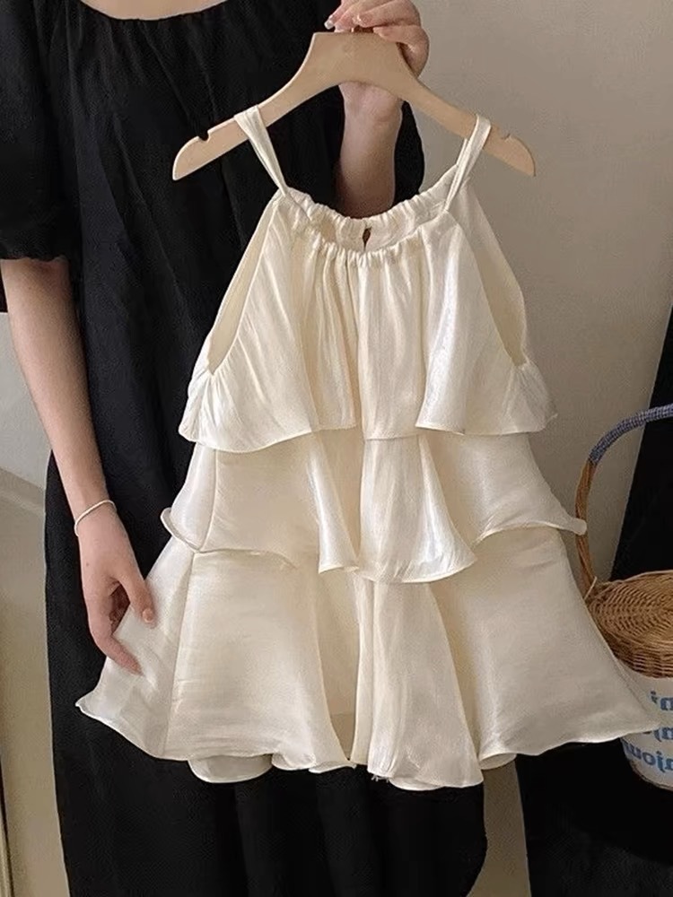 Xianning siete ropa para niños 25 verano nuevo vestido de temperamento dulce para niñas falda de tirantes de pastel con volantes de alta gama