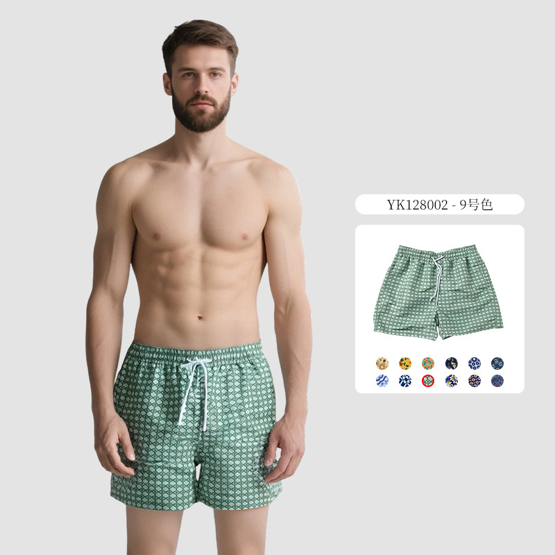 Pantalones de cuatro puntos florales de piel de melocotón para hombre, bañador casual de playa de tamaño europeo, forro de secado rápido, pantalones de playa de vacaciones junto al mar