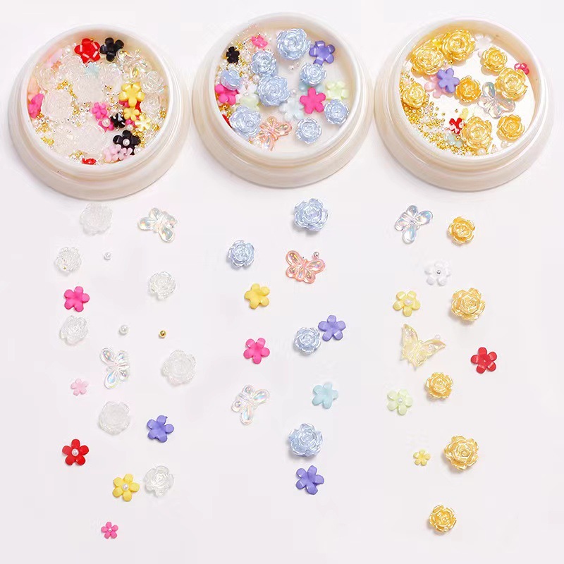 Nueva celebridad en línea suministros de uñas 3D multicolor de alto grado Camelia mariposa cinco pétalos flor bola de acero joyería de uñas diamante