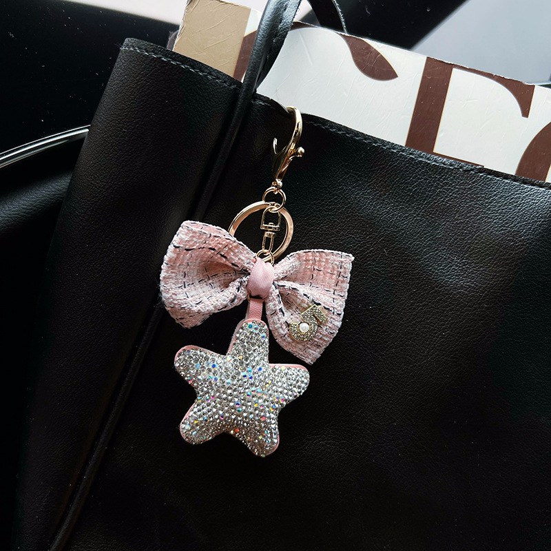 Cerámica creativa con diamantes de arcilla de cinco puntas arco pequeño llavero de viento fragante nuevo cuero estrella bolsa decoración colgante