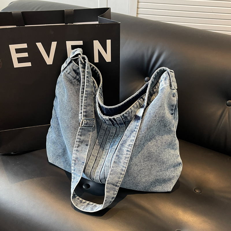 Bolso de mezclilla lavado de viento perezoso para mujer 2025 nuevo bolso de lona literario bolso de hombro de gran capacidad al por mayor