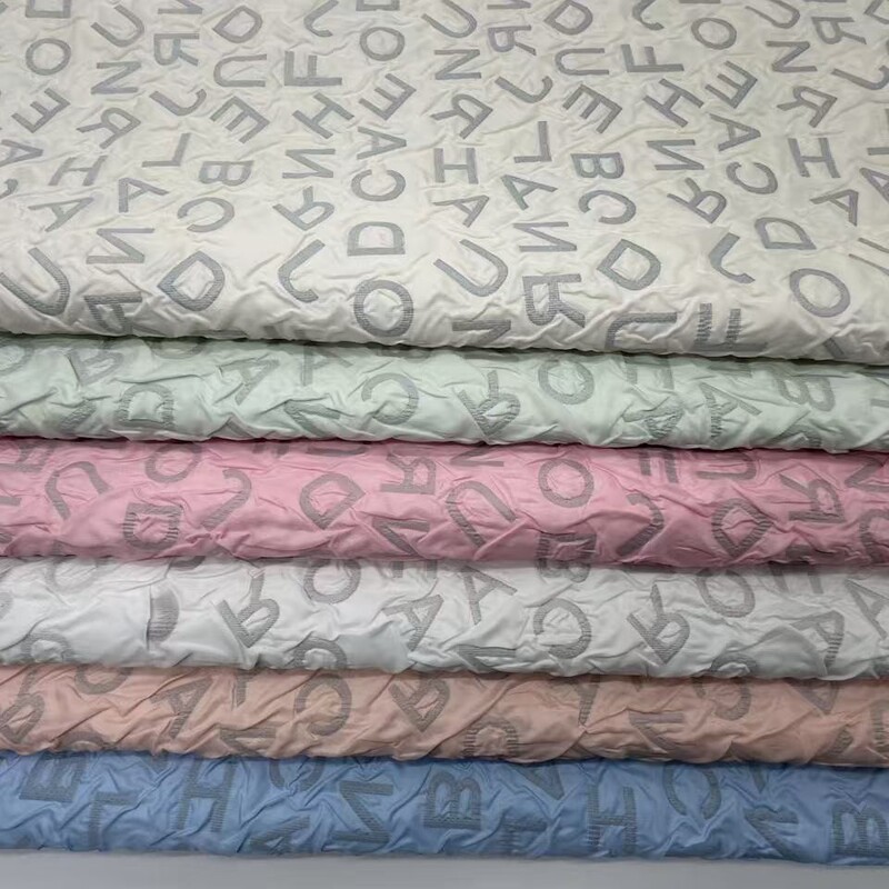 Polyester Embossed Ultrasonic Crinkled Pu Composite Fabric with Lettering, Quilted Fabric for Clothing, Notebooks, Bags, and Luggage Polyester Embossed Ultrasonic Crinkled Pu Composite Fabric with Lettering, Quilted Fabric for Clothing, Notebooks, Bags, and Luggage