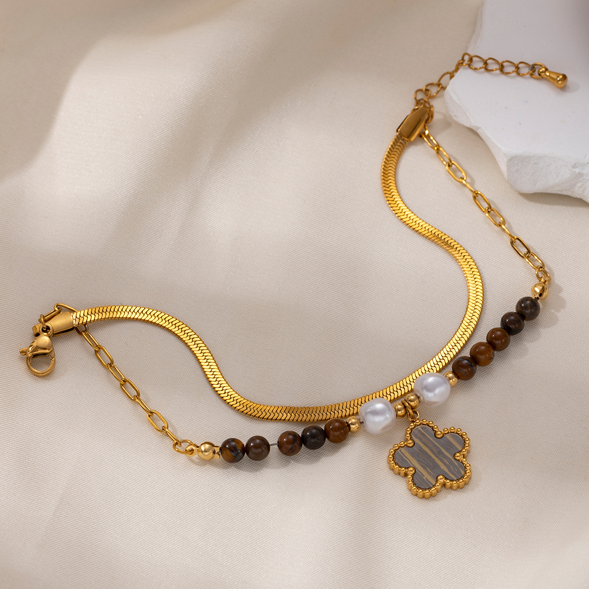 Tina Europa y los Estados Unidos pulsera de acero inoxidable nicho de cuatro hojas de sol cadena cubana cadena de hueso de serpiente cruzada fronteriza joyería de mano caliente mujer
