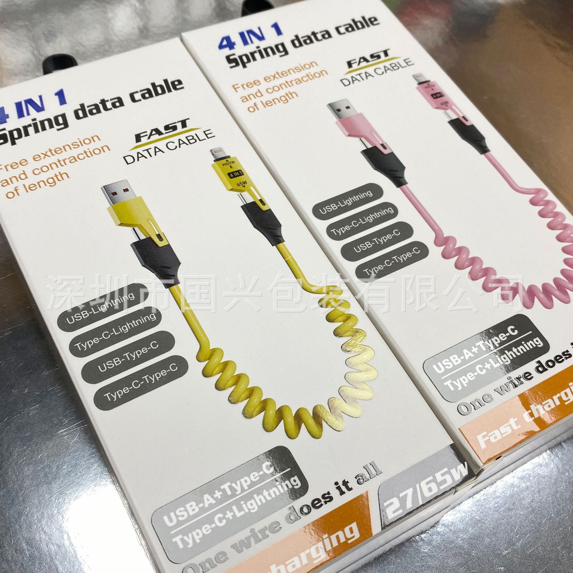 65W resorte telescópico cuatro en uno caja de embalaje de cable de datos neutro cable de datos cargado rápido un arrastre cuatro usb