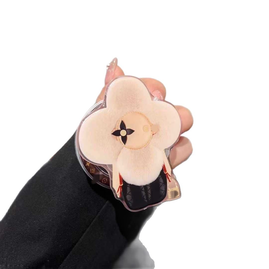 新型高級マグネットスタンドマグネット式携帯ケース通用太陽花マグネット式エアバッグスタンドはおしゃれで豪華です。